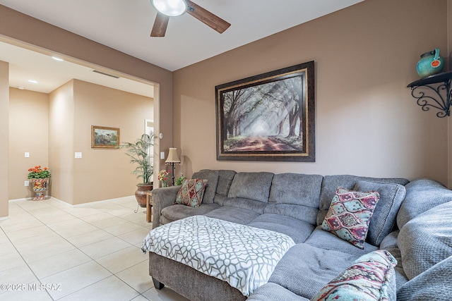 tiled living room with ceiling fan