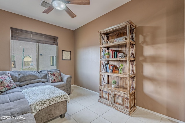 living room featuring ceiling fan and light tile patterned floors