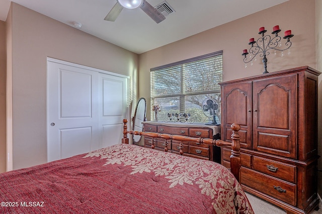 bedroom with ceiling fan, a closet, and carpet