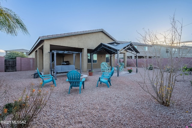 rear view of property featuring a patio