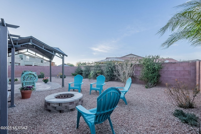 view of patio featuring an outdoor fire pit