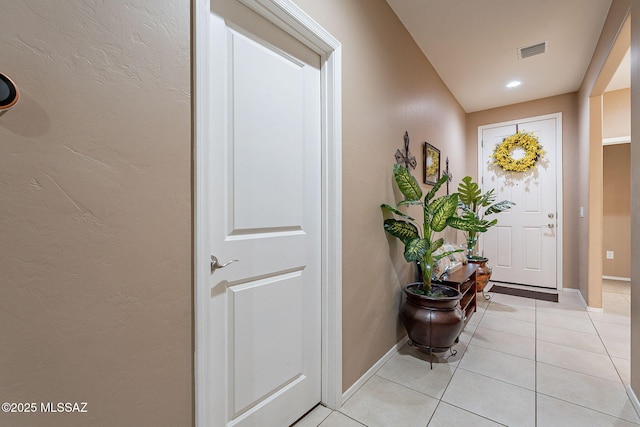 doorway to outside featuring light tile patterned floors