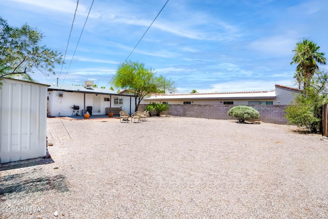 back of property with a patio area