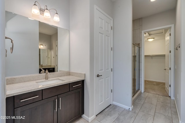 bathroom featuring vanity and a shower with shower door