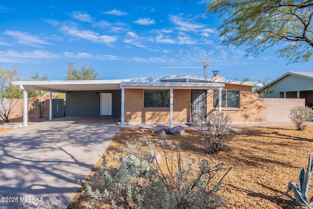 single story home with a carport