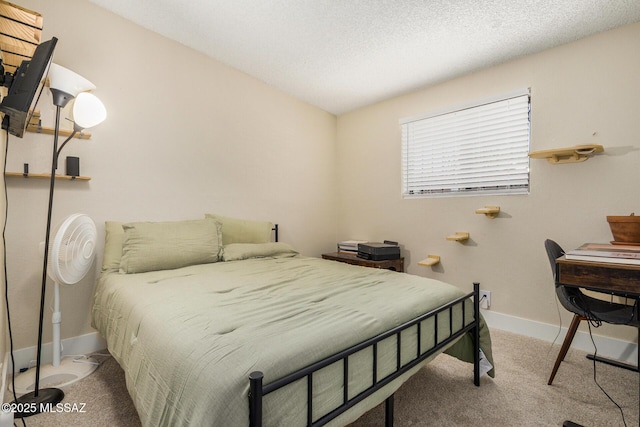 bedroom featuring a textured ceiling and carpet