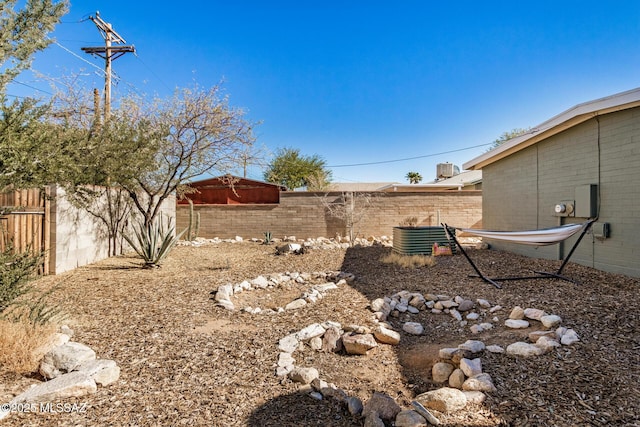 view of yard featuring central air condition unit