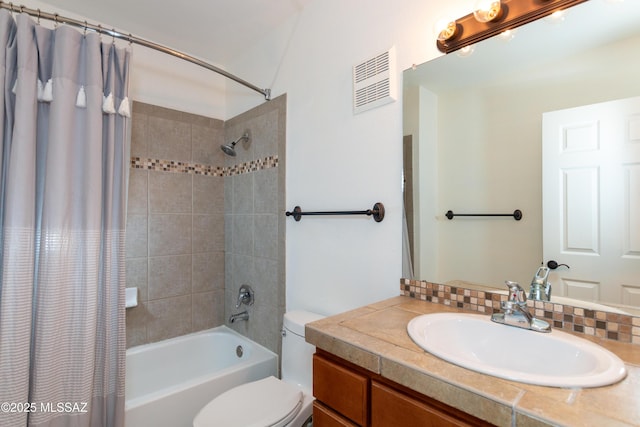 full bathroom featuring vanity, shower / tub combo, and toilet