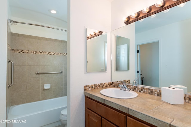 full bathroom featuring vanity, toilet, backsplash, and tiled shower / bath