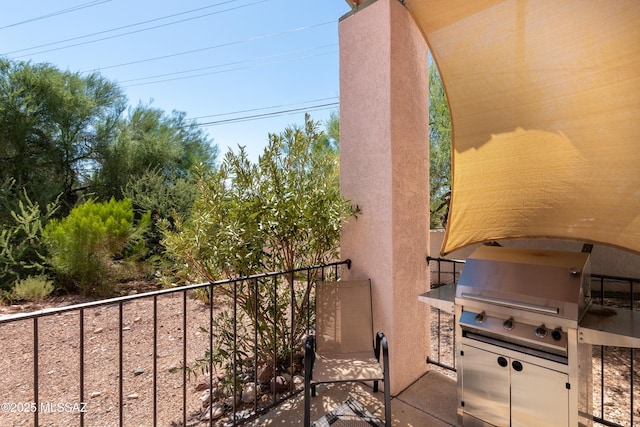 balcony featuring area for grilling