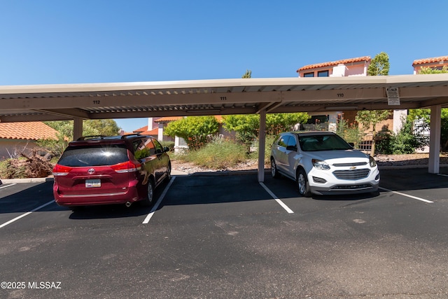 view of vehicle parking featuring a carport