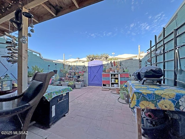 view of patio with a grill