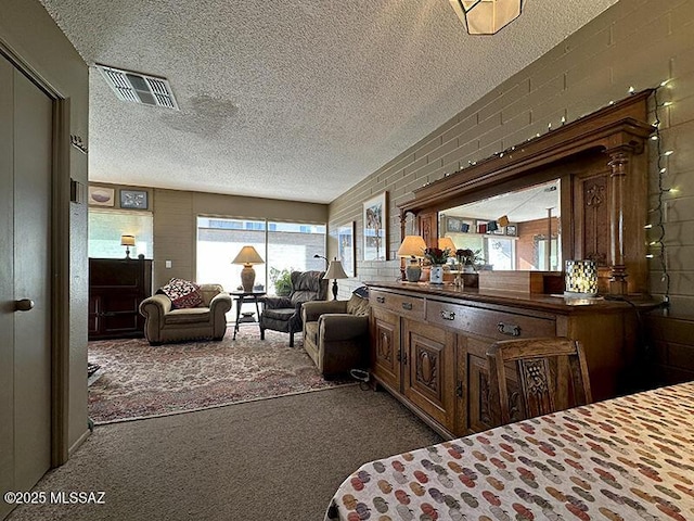 carpeted bedroom with a textured ceiling