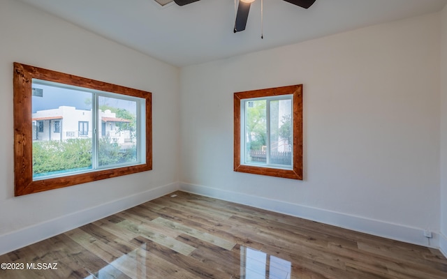 spare room featuring ceiling fan and light hardwood / wood-style flooring