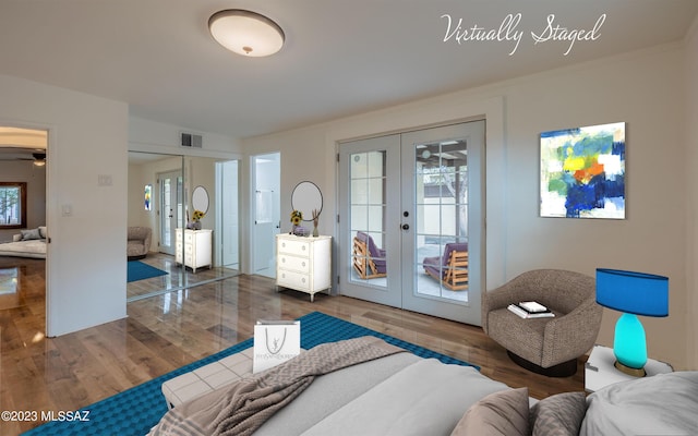 living room featuring french doors, dark hardwood / wood-style floors, and ceiling fan