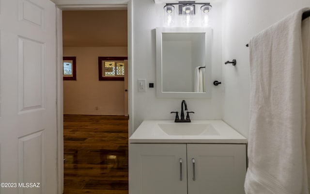 bathroom with hardwood / wood-style floors and vanity