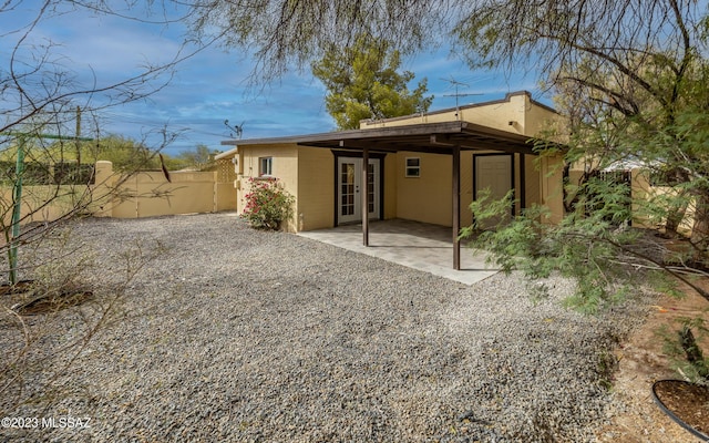 back of house featuring a patio area and french doors