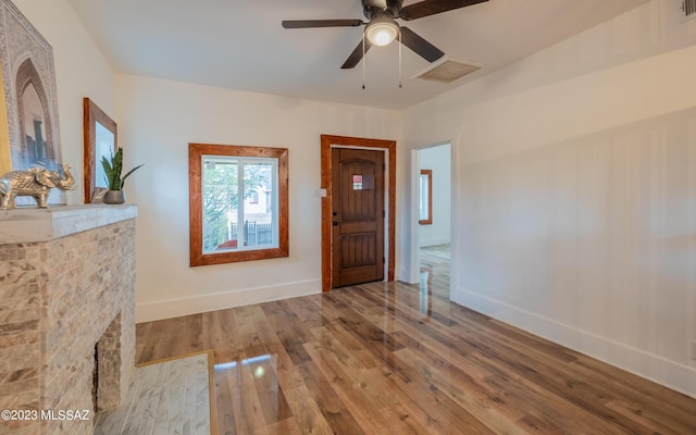 entrance foyer featuring ceiling fan and hardwood / wood-style floors