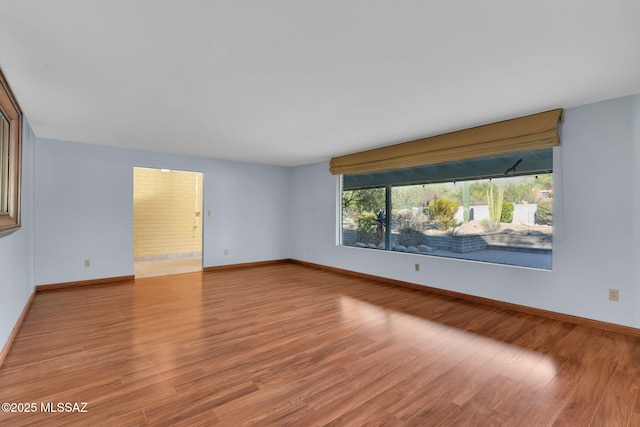 spare room featuring light hardwood / wood-style floors