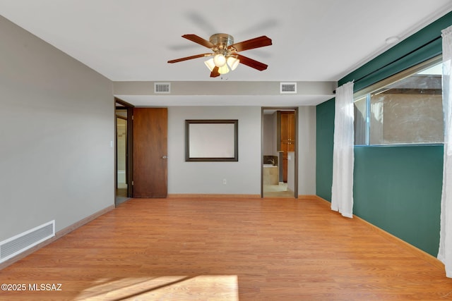 unfurnished room featuring ceiling fan and light hardwood / wood-style floors