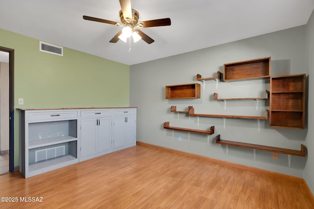 interior space with ceiling fan and light hardwood / wood-style floors