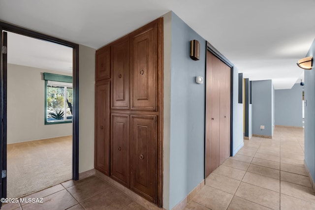 hallway with light tile patterned flooring