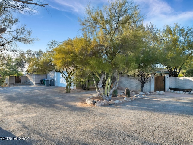 view of property hidden behind natural elements