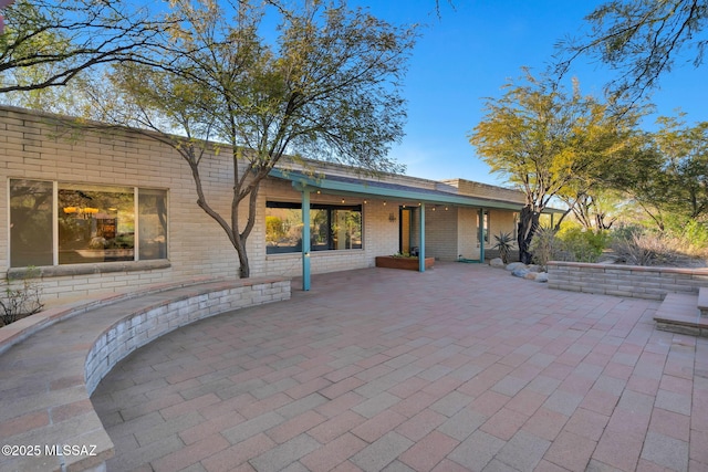 rear view of property with a patio area