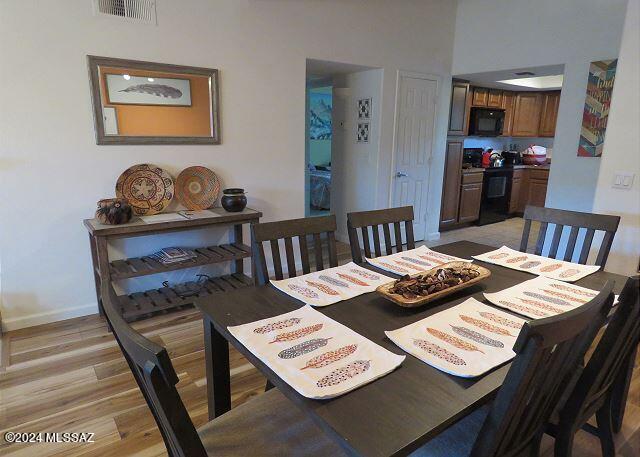 dining area with light hardwood / wood-style flooring