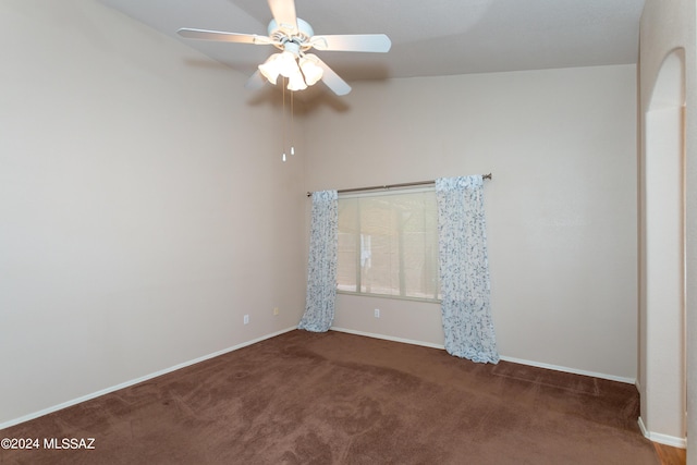 carpeted empty room featuring ceiling fan