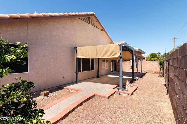 back of property with a patio area