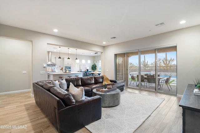 living room with light hardwood / wood-style floors