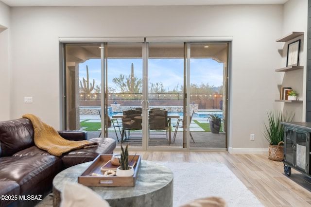 living room featuring light hardwood / wood-style floors and plenty of natural light