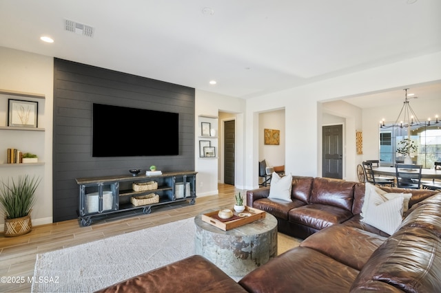 living room with an inviting chandelier