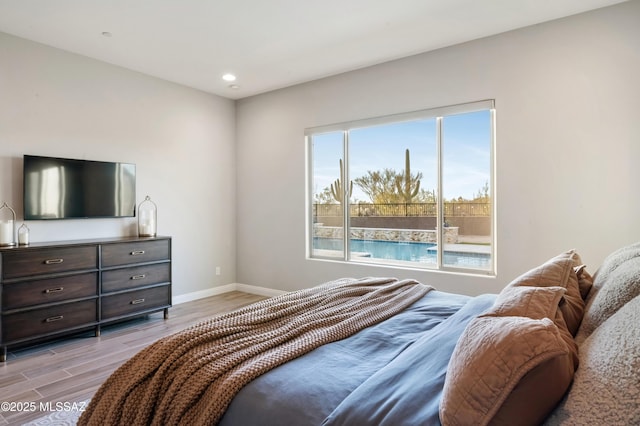 bedroom with light wood-type flooring