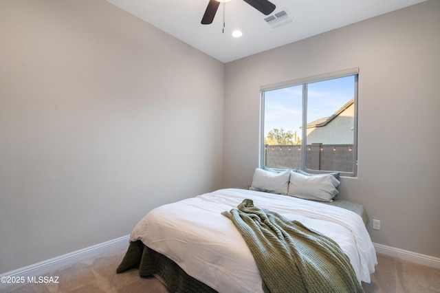 carpeted bedroom with ceiling fan