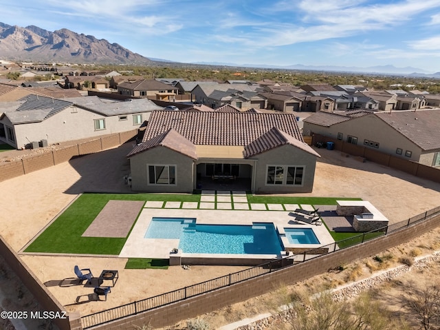 view of pool featuring a patio and a mountain view