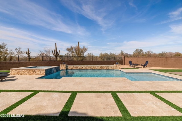 view of swimming pool with a patio and an in ground hot tub