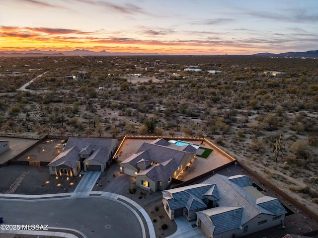 aerial view at dusk with a mountain view