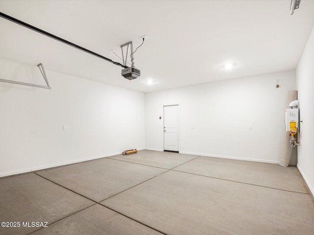 garage featuring recessed lighting, baseboards, and a garage door opener