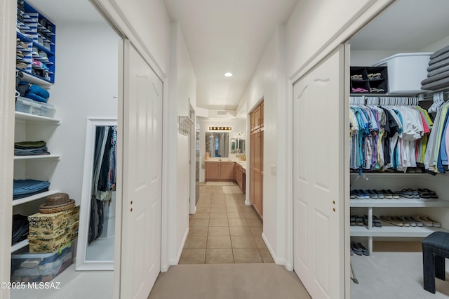 63111 E Mountain Crest Dr, Tucson, AZ 85739 - hall featuring light tile patterned flooring, recessed lighting, and light colored carpet