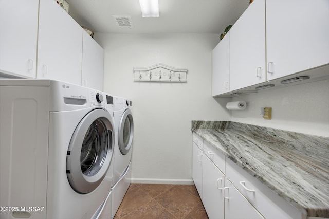 63111 E Mountain Crest Dr, Tucson, AZ 85739 - washroom featuring cabinet space, washing machine and dryer, and baseboards