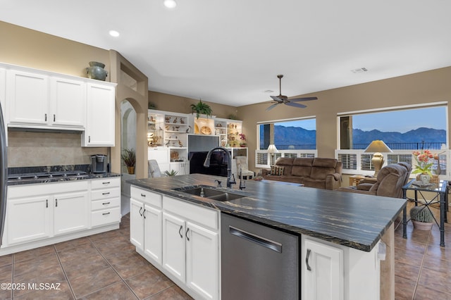 63111 E Mountain Crest Dr, Tucson, AZ 85739 - kitchen with a sink, dark countertops, dishwasher, ceiling fan, and open floor plan