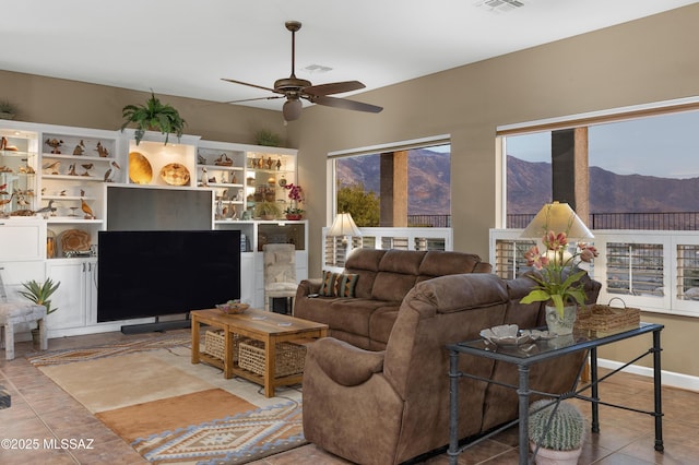 63111 E Mountain Crest Dr, Tucson, AZ 85739 - tiled living area featuring ceiling fan and a mountain view