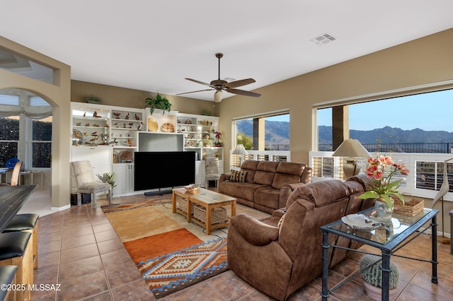 63111 E Mountain Crest Dr, Tucson, AZ 85739 - tiled living room featuring ceiling fan