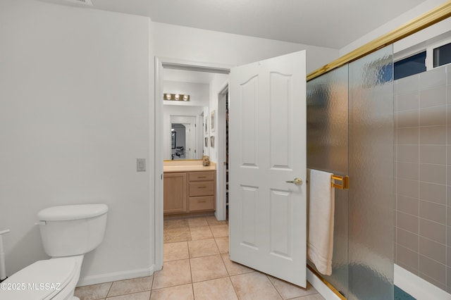 63111 E Mountain Crest Dr, Tucson, AZ 85739 - full bathroom featuring vanity, a shower stall, tile patterned floors, and toilet