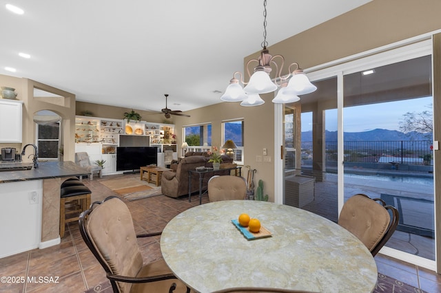 63111 E Mountain Crest Dr, Tucson, AZ 85739 - dining space featuring a ceiling fan, a chandelier, and tile patterned floors