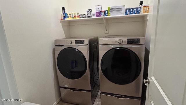 laundry room featuring washer and clothes dryer