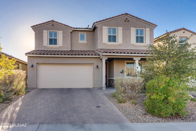 mediterranean / spanish-style home featuring a garage