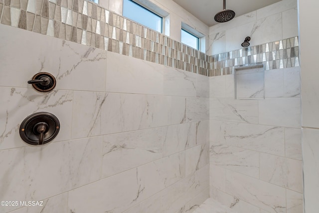 bathroom with a tile shower